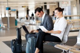 12897881 - business travellers waiting for their flight at airport