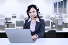 22305167 - smiling young woman operator with headset at office